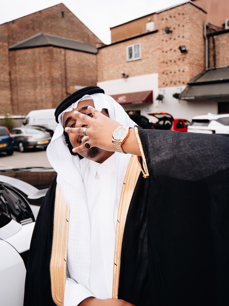 Editorial Portrait in Traditional Arabic Dress showing Rolex Watch